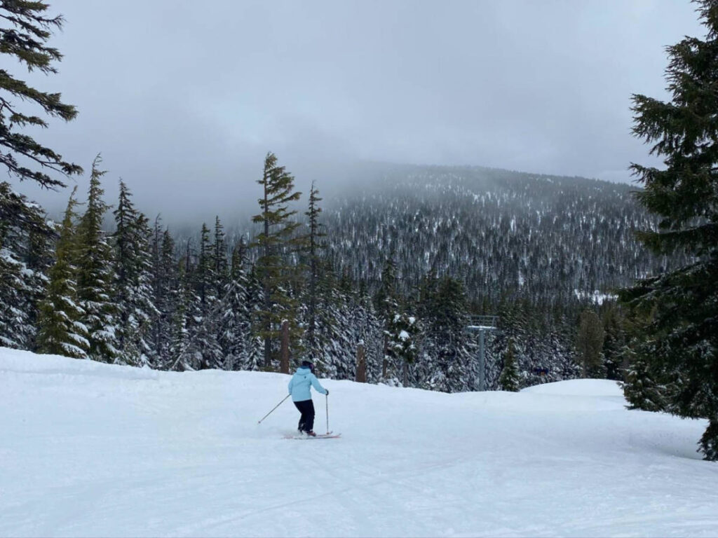 A person skiing down a blue run at Big Bear Mountain Resort