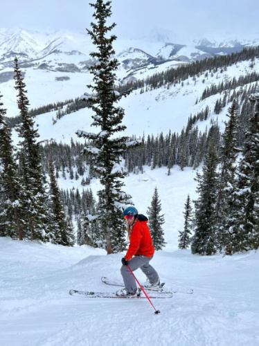 The author's husband skiing down the Headwall Glades