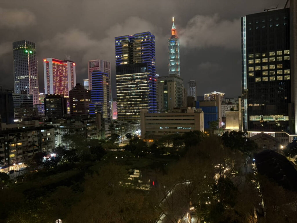 View of the Taipei 101 and the city skyline from the hotel balcony at night