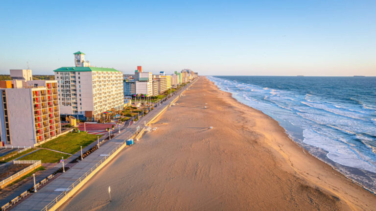 Overlooking view of the oceanfront skyline and the vast shoreline at sunset