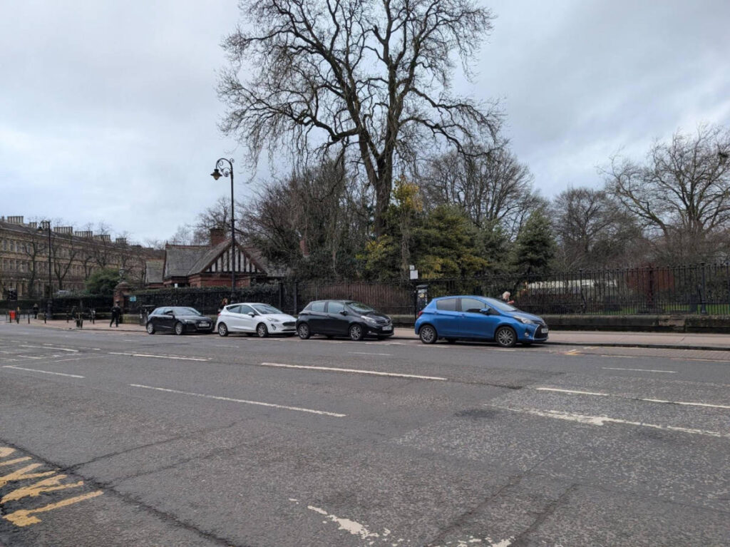 Small cars parked on a street