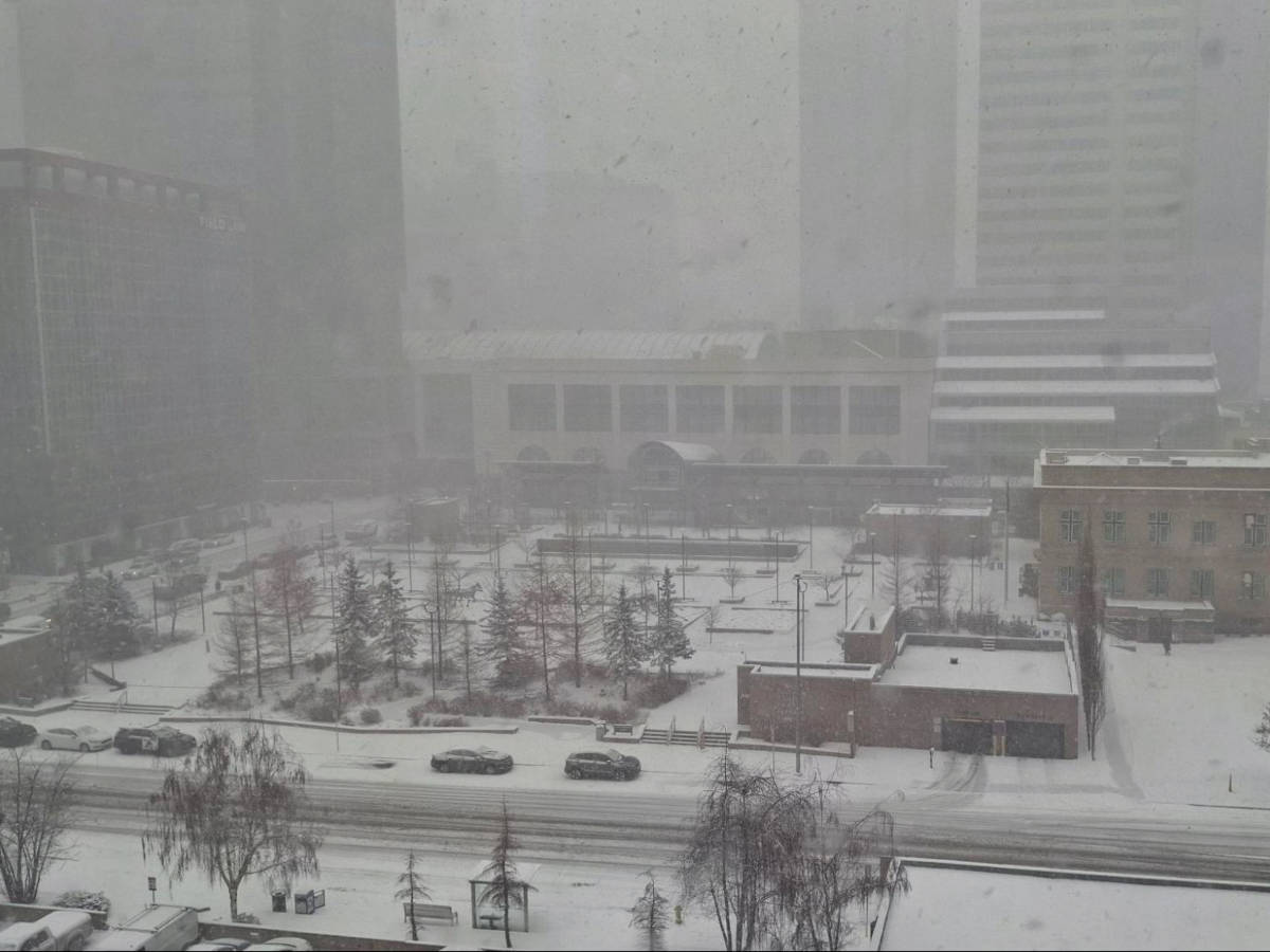 Overlooking snow covered view of the street from the hotel room