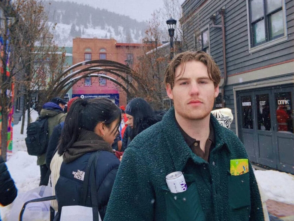 The author's boyfriend looking at the camera during a snowy day in Park City