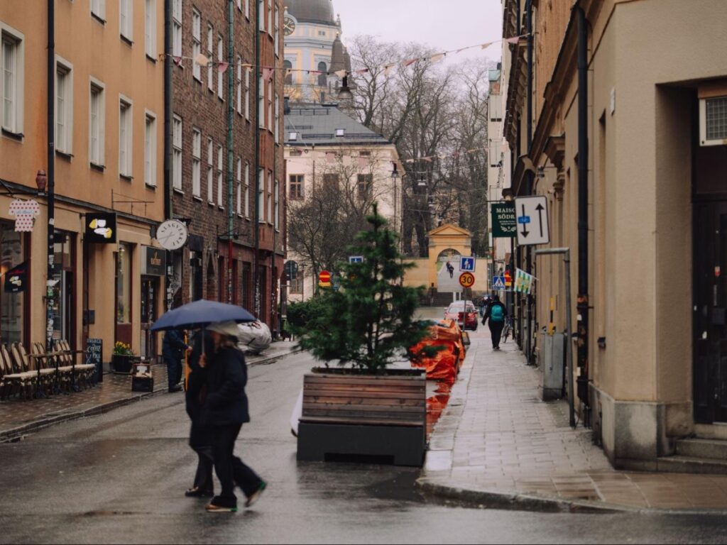 People walking with their umbrellas in Södermalm on a rainy day