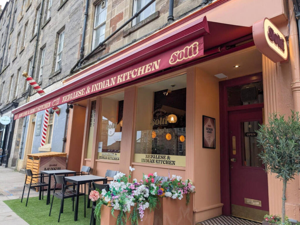 View of the outdoor seating and the colorful exterior of Solti