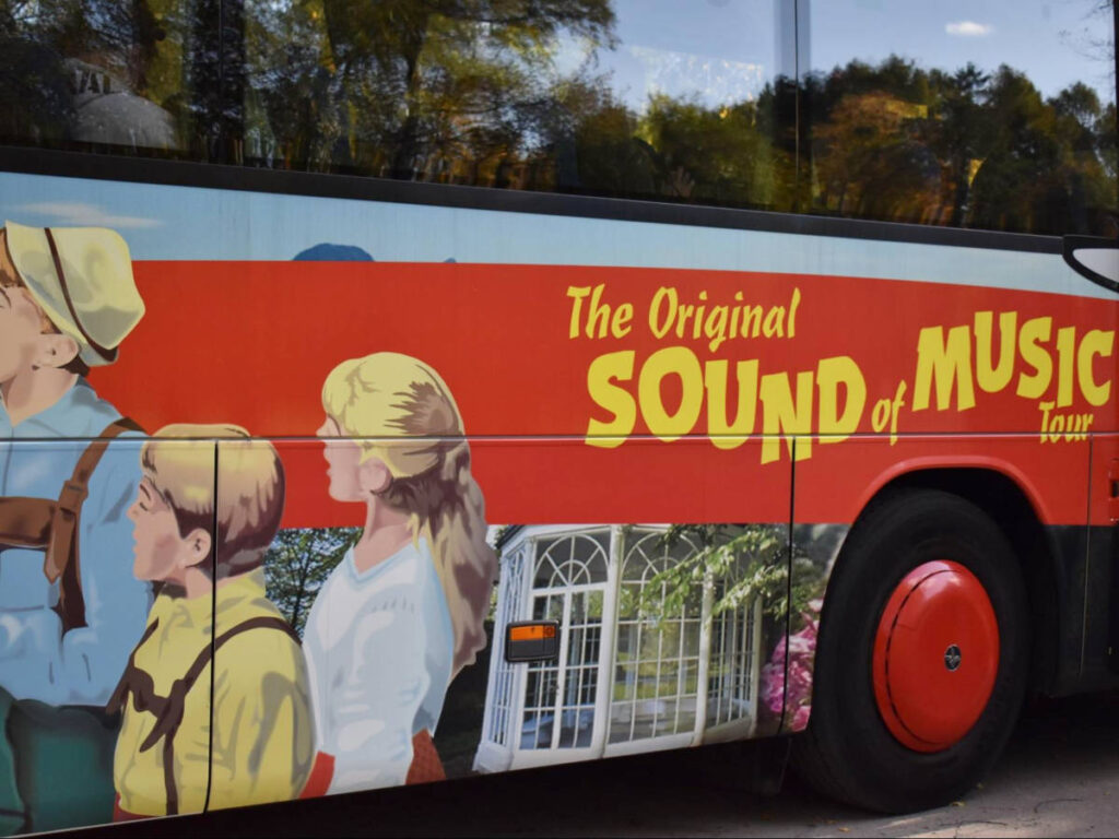 The graphic design of Sound of Music on the exterior of the red tour bus
