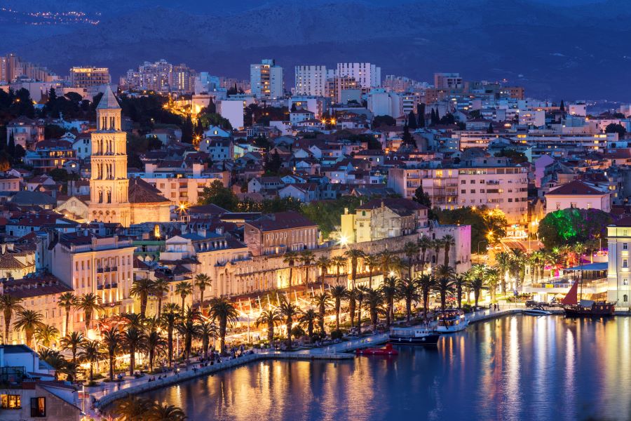 An aerial view of Split Croatia at blue hour, view of the promenade and old city