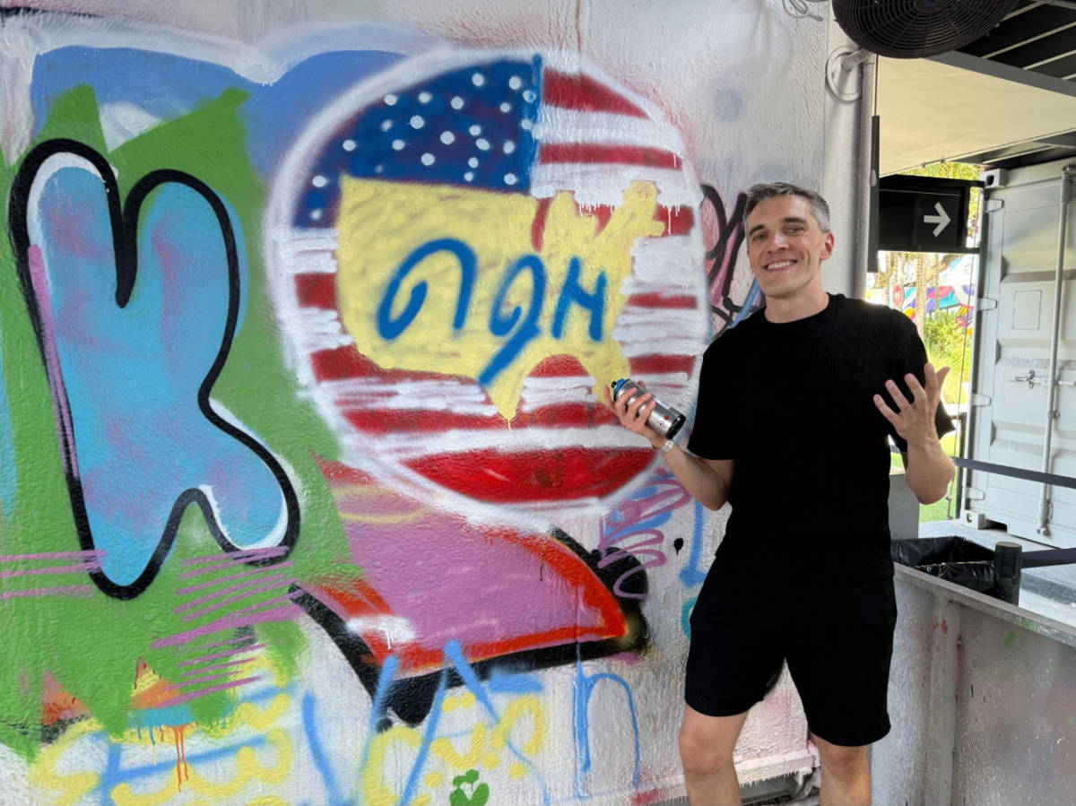 Travel Lemming founder, Nate Hake showing off his spray painting skill in Wynwood Walls