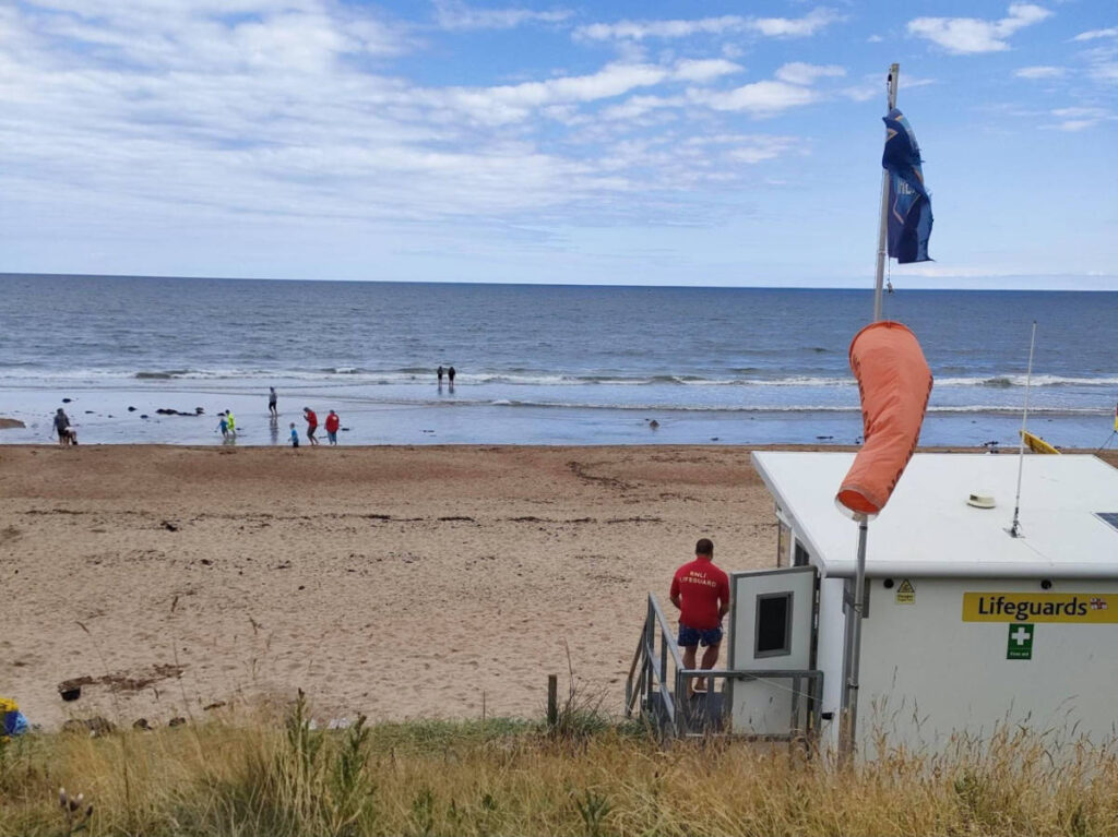 View of the lifeguard station and the beachgoers at the St Andrews Beach