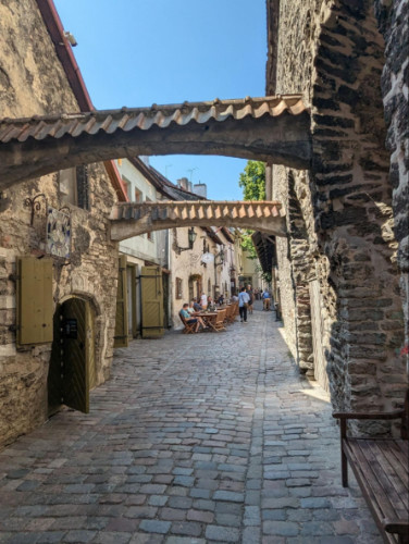 View of the cobblestone street with an archway at St Catherine’s Passage
