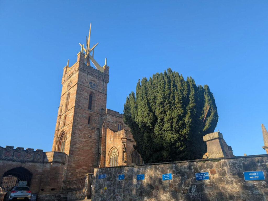 View of St Michael’s Parish Church next to a tree