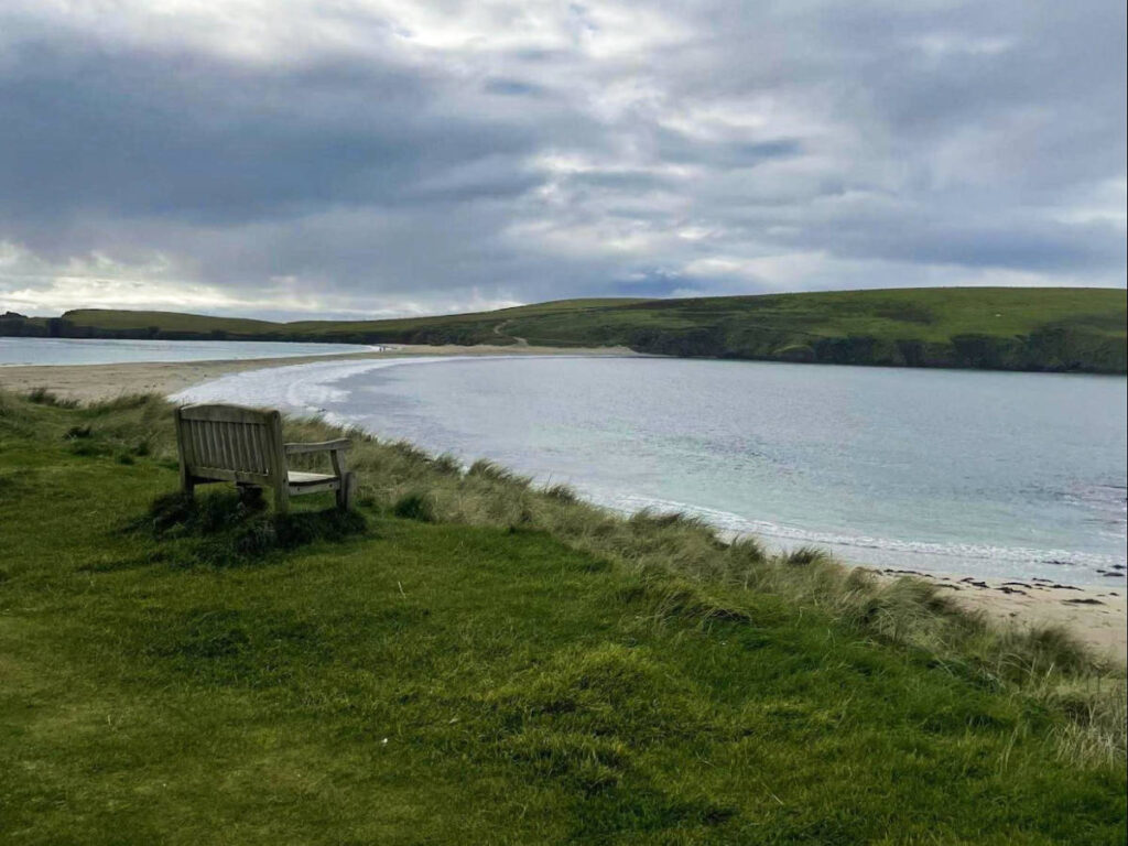 A bench overlooking the St Ninian’s beach