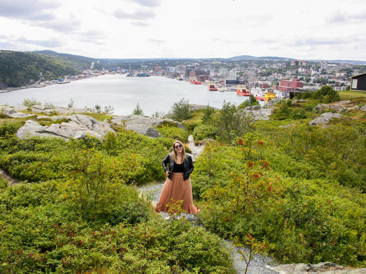 The author, Taylor Herperger with an overlooking view of St. John’s, Newfoundland and Labrador on her background
