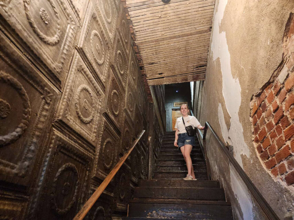 The author Sarah Heath at the staircase in Paschall Bar