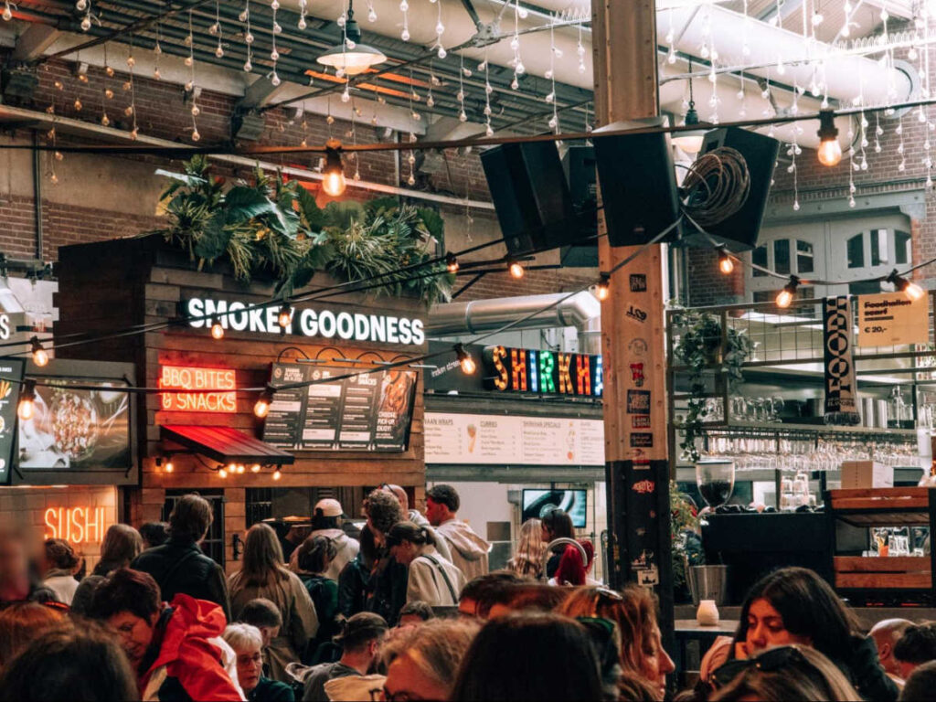 View of the stalls and the crowd in De Foodhallen