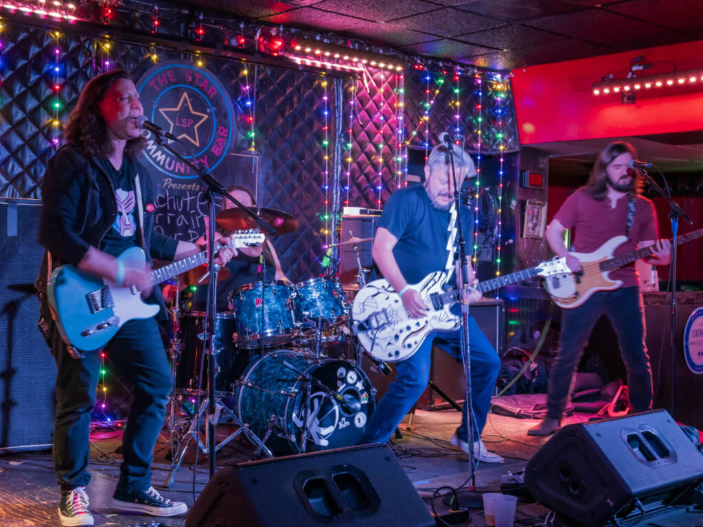 Local band Bad Liars performing on stage at Star Community Bar