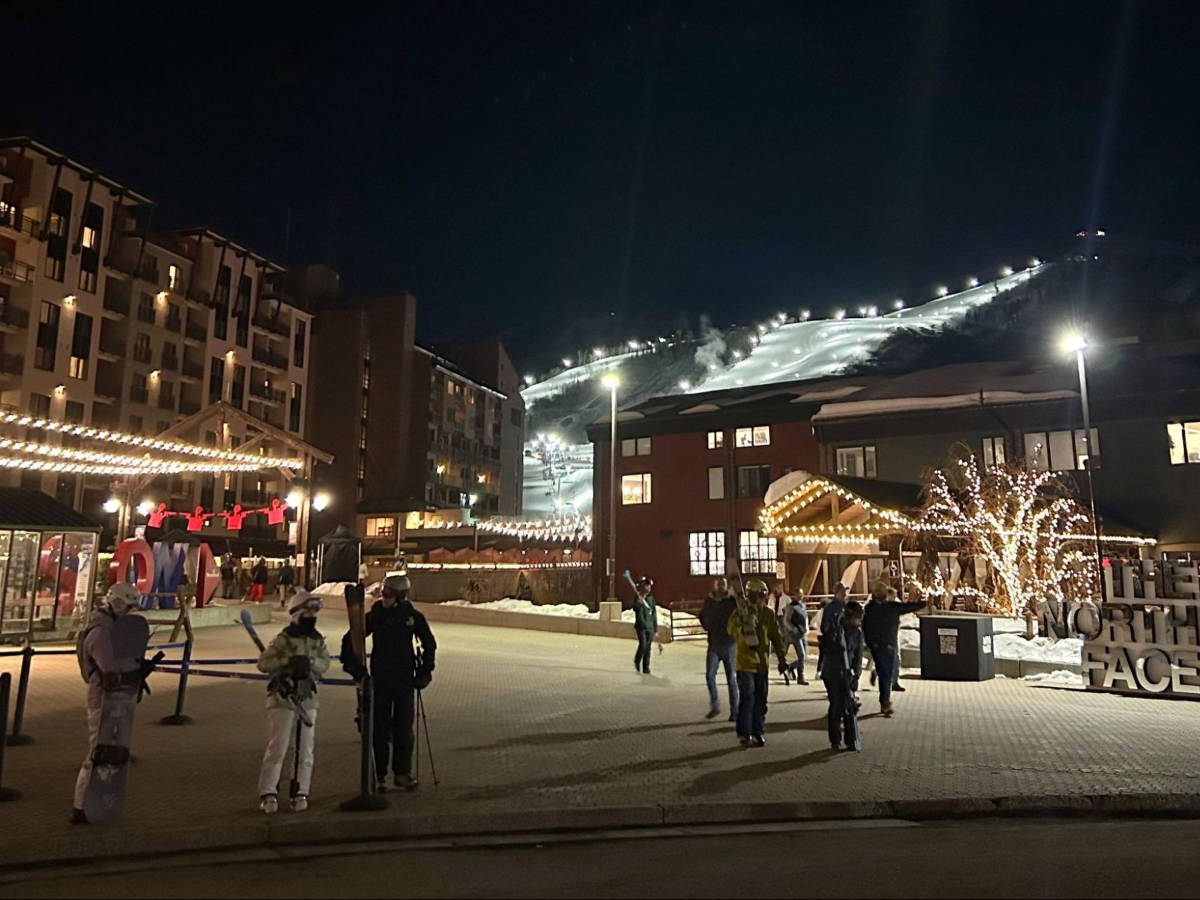 View of the skiers preparing to ski at night