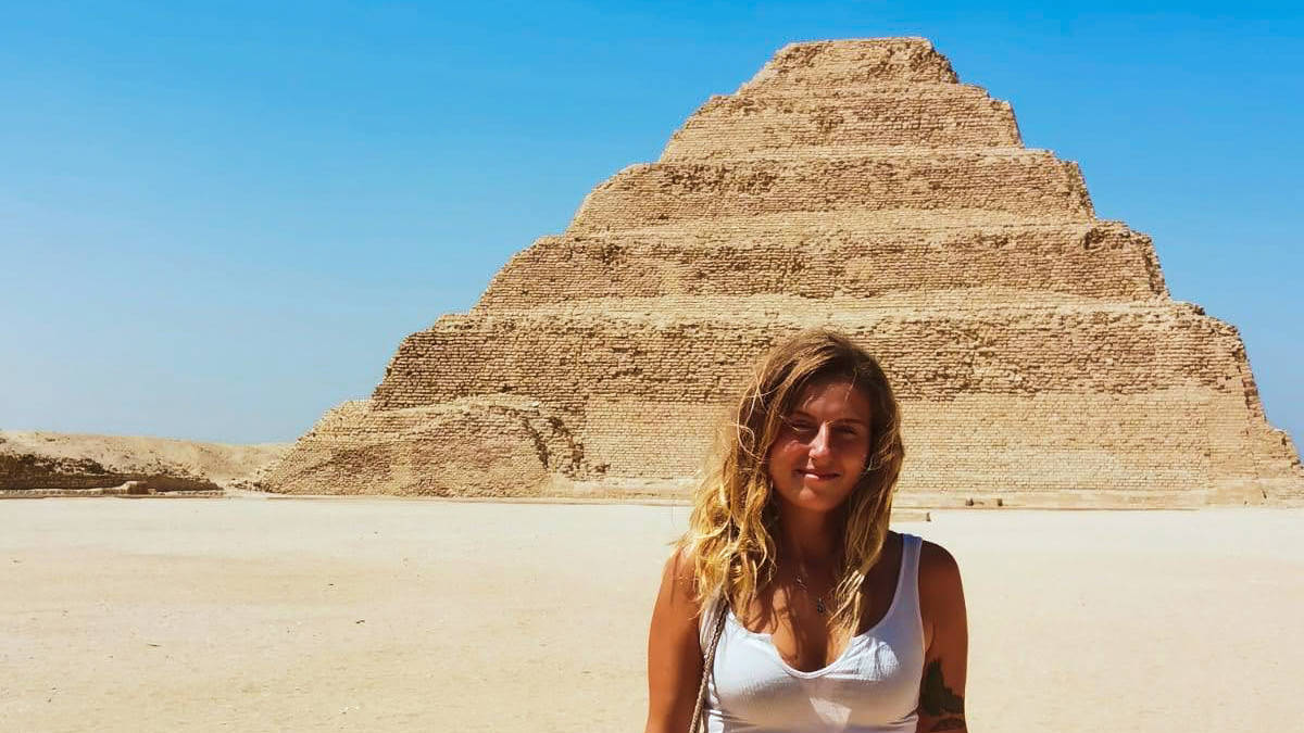 The author, Kate McMahon standing in front of the Step Pyramid of Djoser