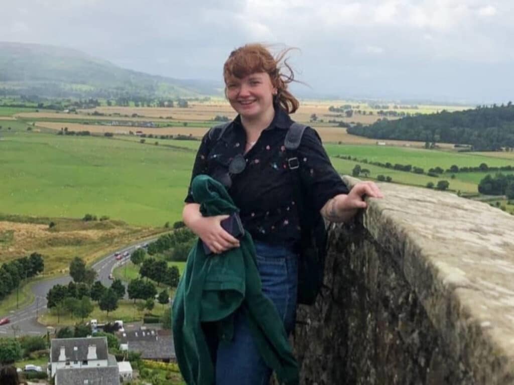 The author, Louise Wylie smiling for a photo at the Stirling Castle
