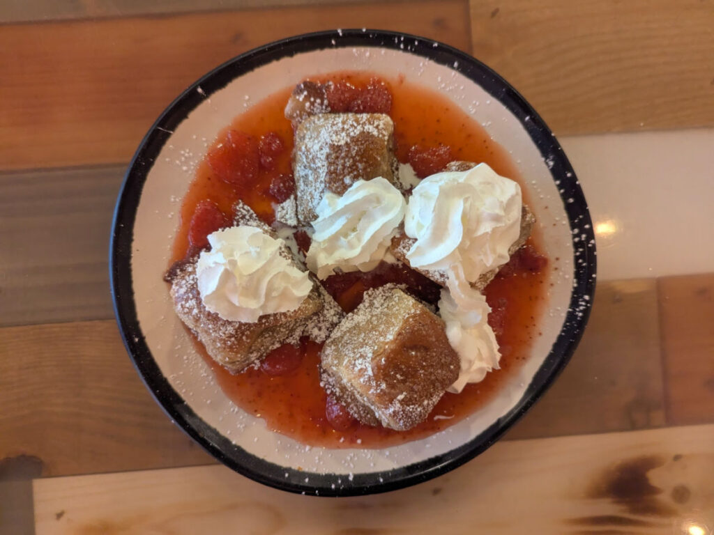 Top view of a Strawberry French toast with whipped cream