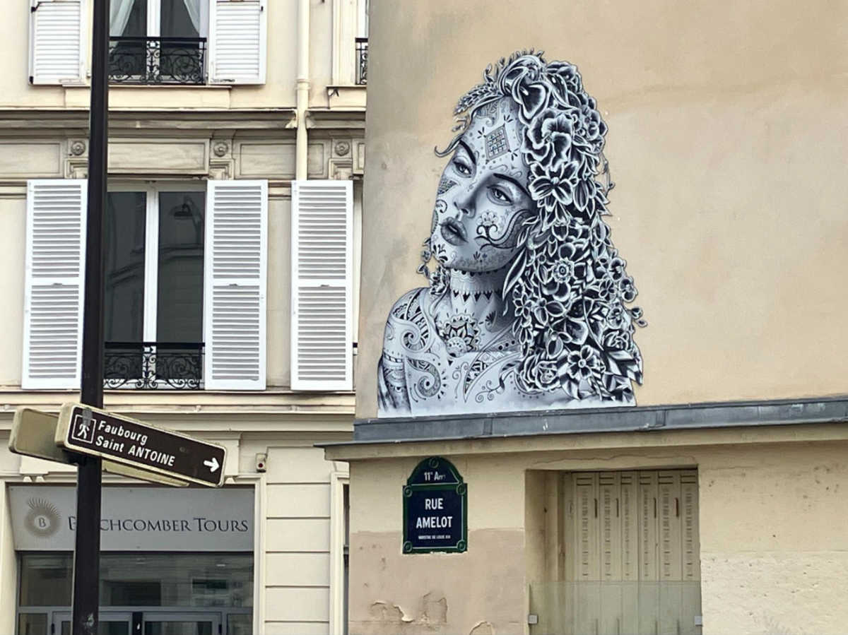 A street art of a woman in the 11th arrondissement