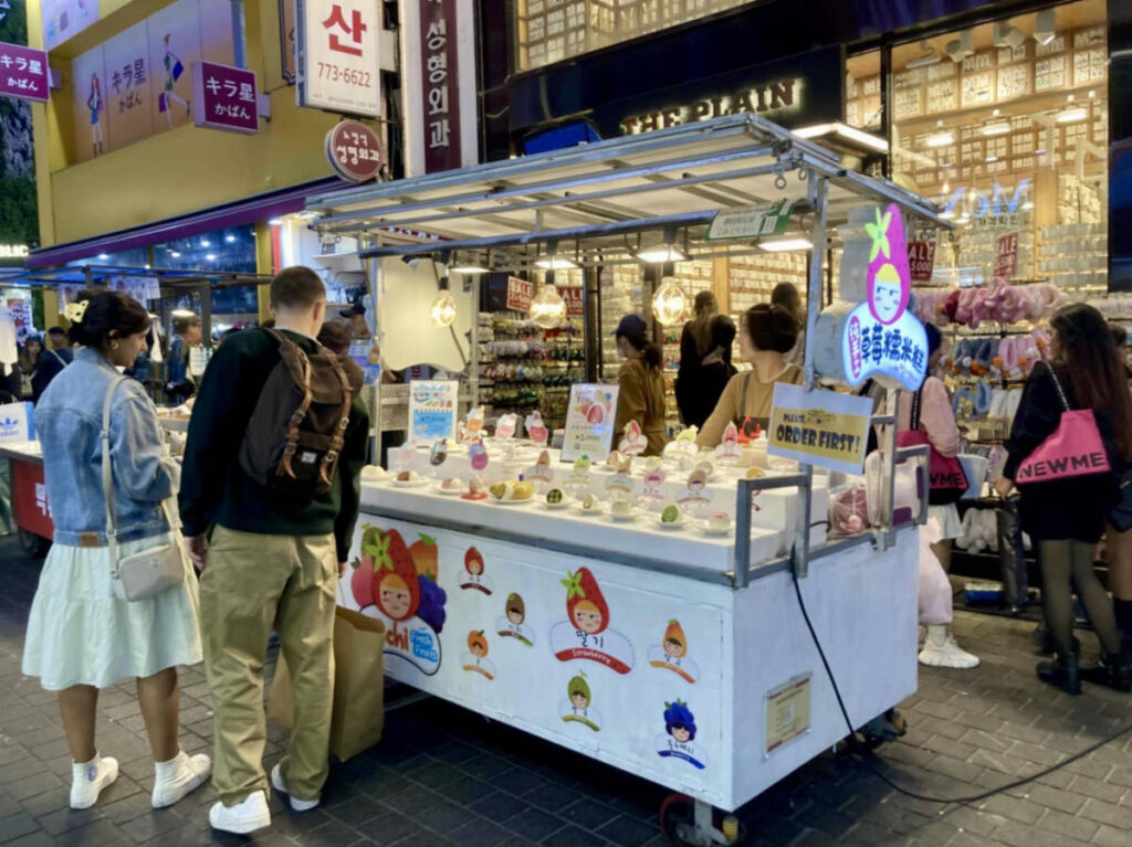 A fruit-filled rice cake cart in Myeongdong