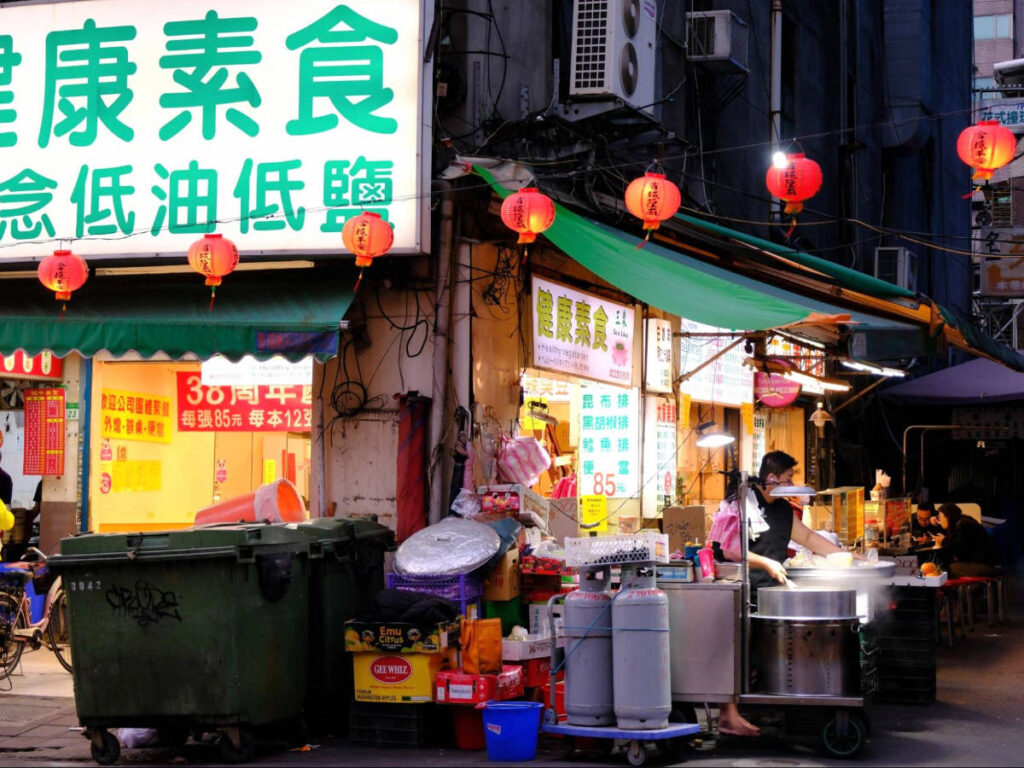 A street food vendor preparing a food in Zhongzheng