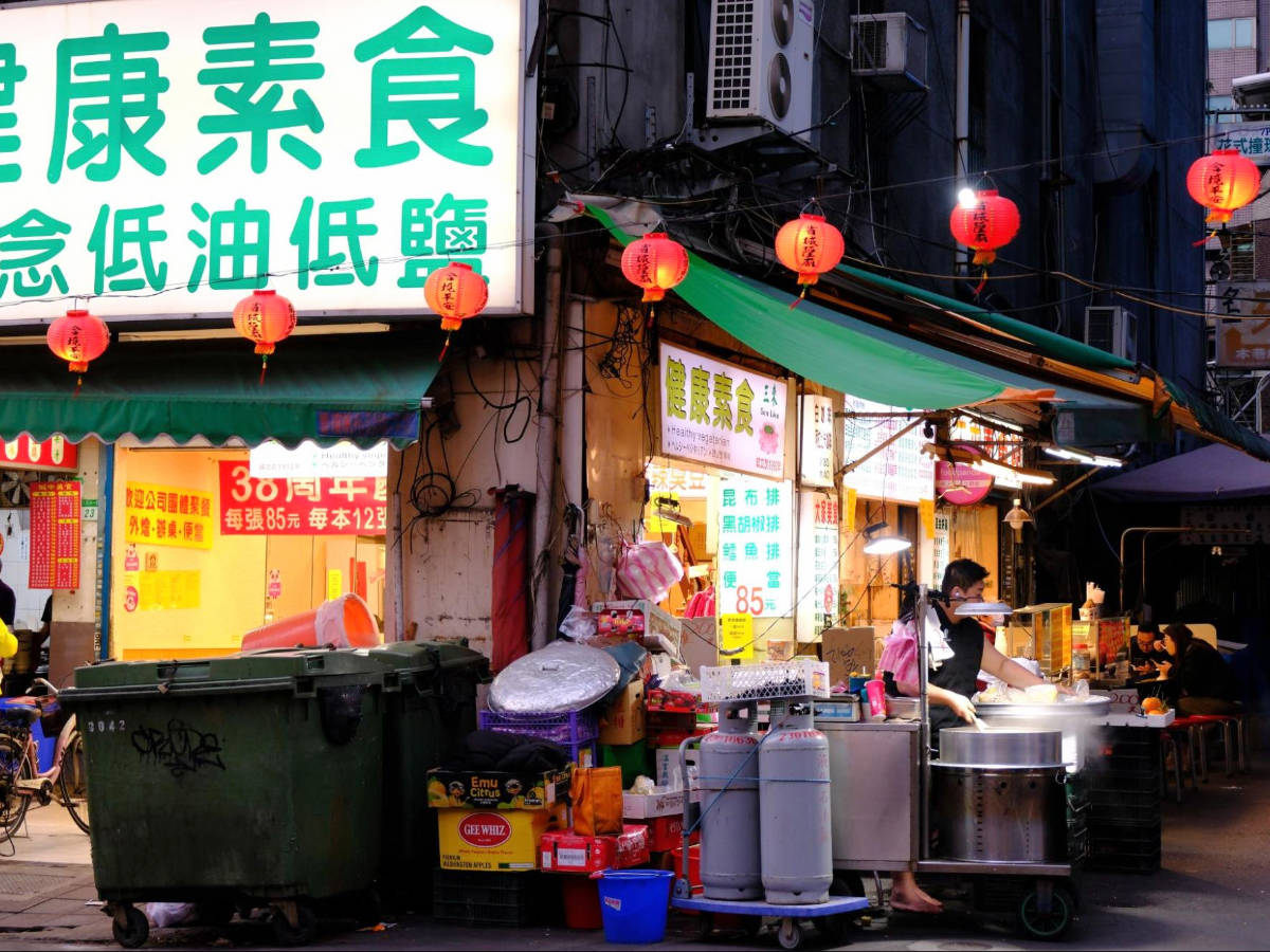 A street food vendor preparing a food in Zhongzheng