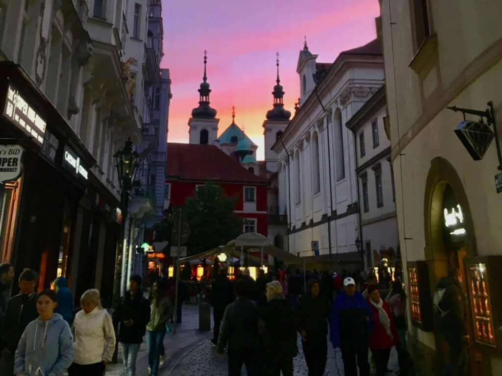 Colorful sky over the busy streets in Prague