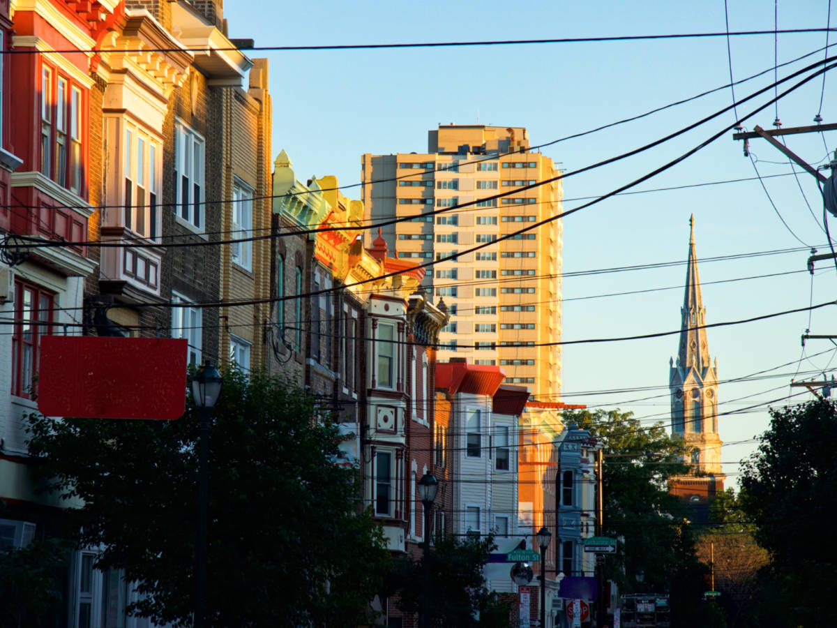 Scenic view of the sunset over the buildings in the Queen Village