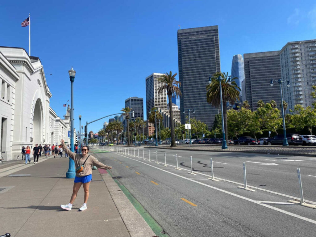The author's partner posing for a photo at the the Embarcadero waterfront