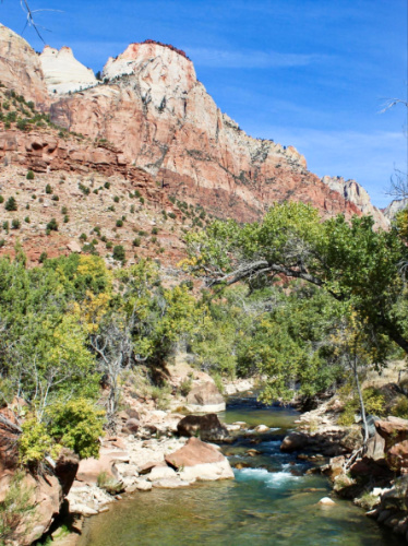 Scenic view of the rock mountain and river in Zion National Park on a sunny day