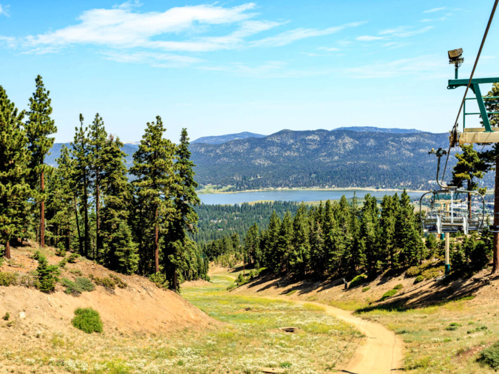 Panoramic view of the landscape and the lake from the Snow Summit ski lift on a sunny day