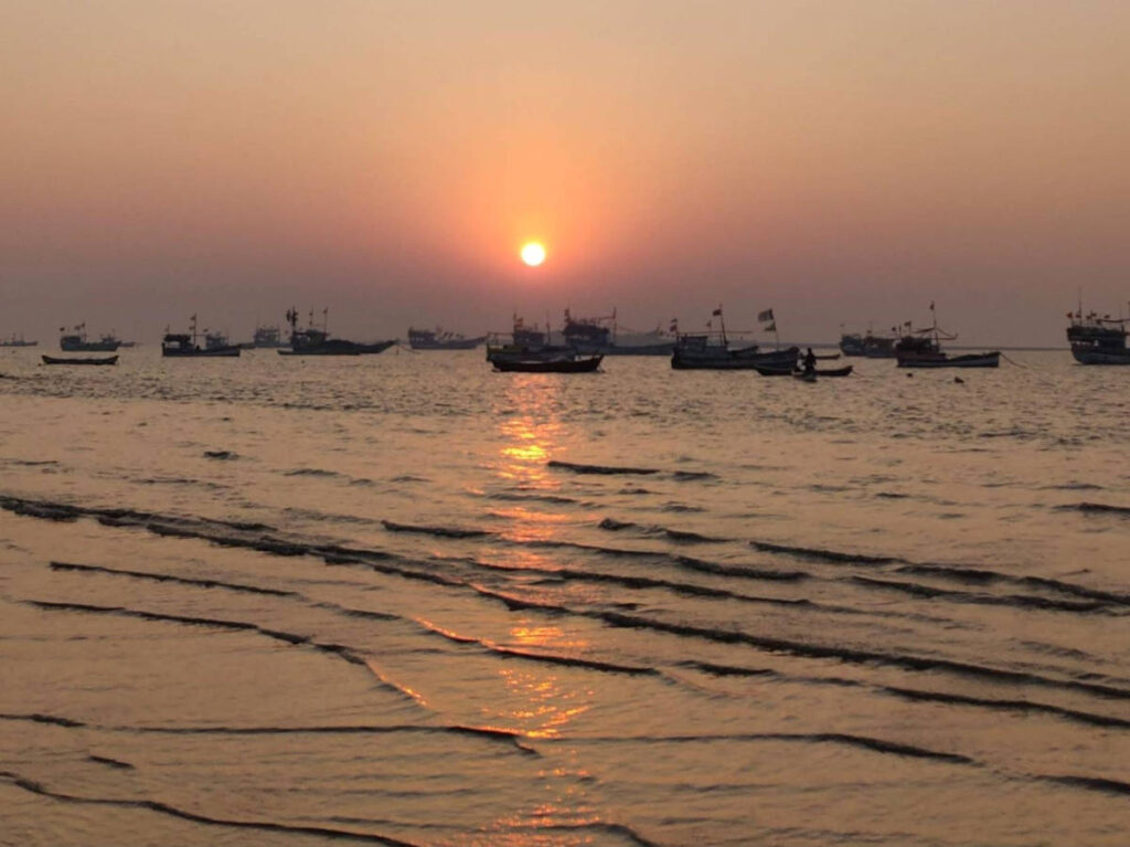 Fishing boats at Gorai Beach during sunset