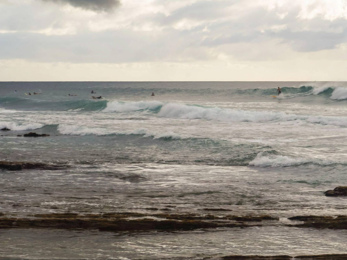 The surfers enjoying the huge waves at Maria’s Beach