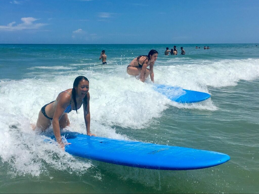 Author Betty and her friend surfing in LA