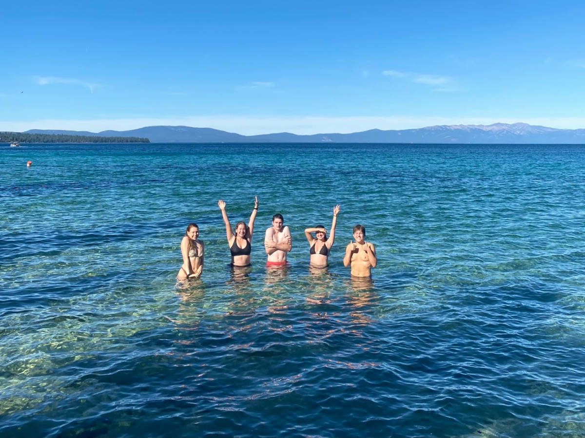 A group of friends swimming in Lake Tahoe