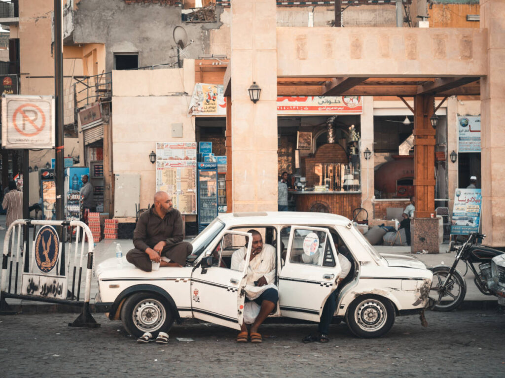 People sitting in the vintage taxi in Egypt