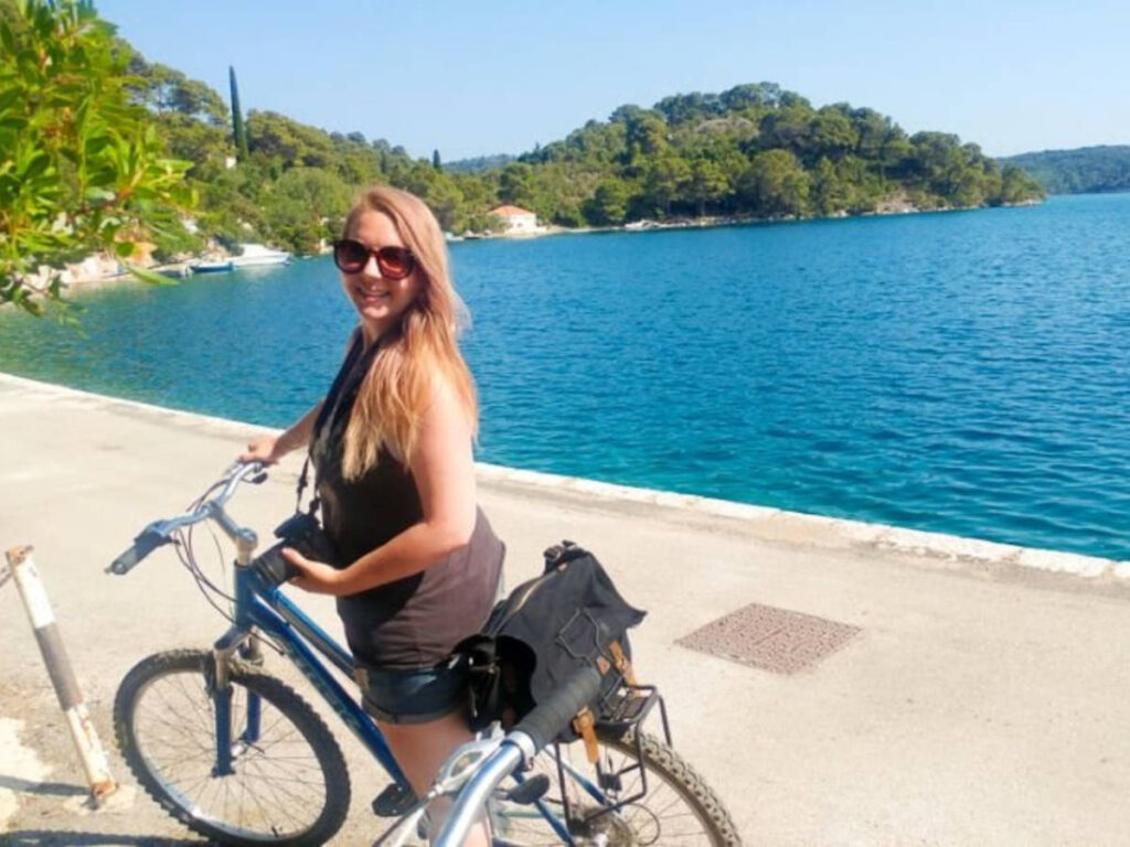 The author Taylor Herperger, posing on her bike at Mljet Island