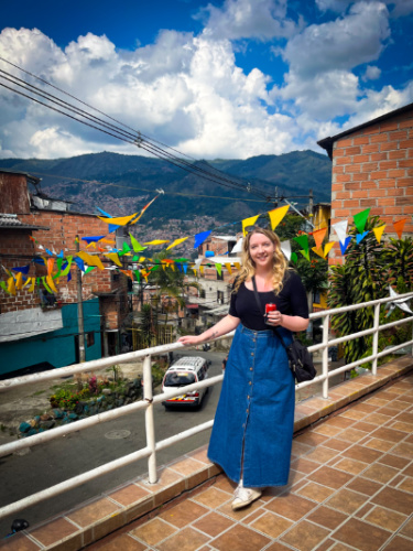 The author Taylor Herperger, holding a drink in Medellin