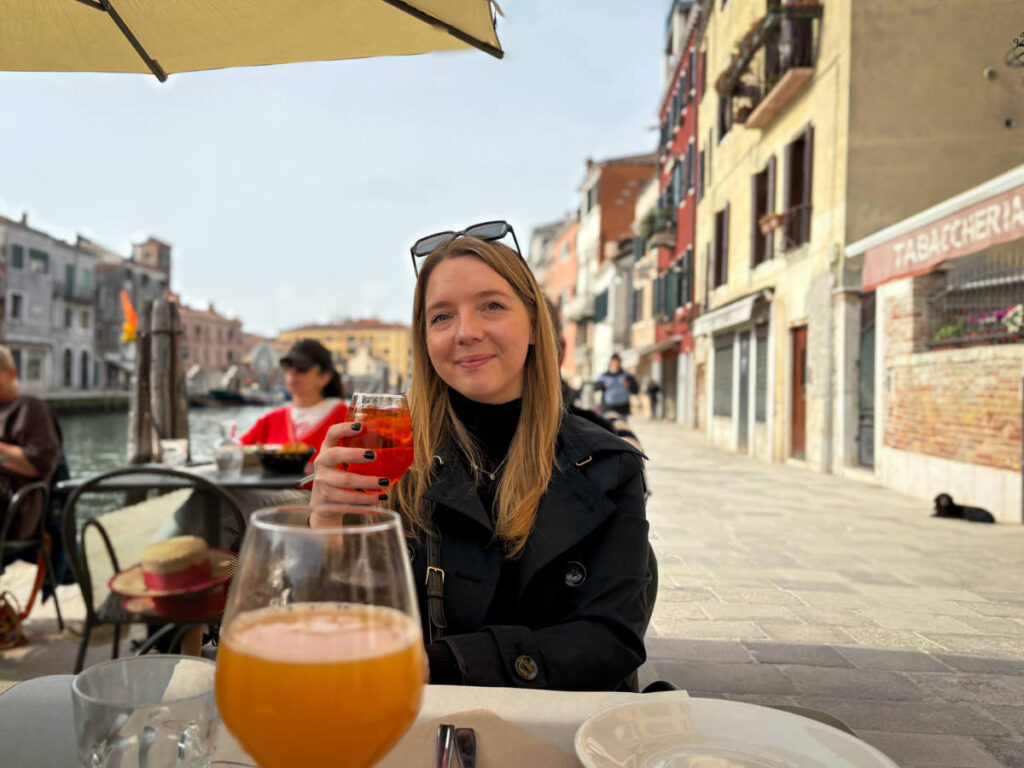 The author Taylor Herperger, enjoying her cicchetti & a spritz in Cannaregio