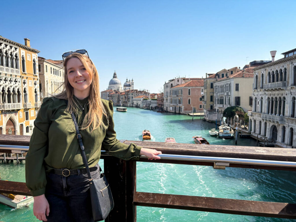 The author Taylor Herperger, enjoying the overlooking view of the canal at Ponte dell'Accademia
