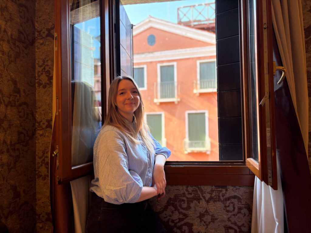 The author Taylor Herperger, enjoying the canal view in Splendid Venice