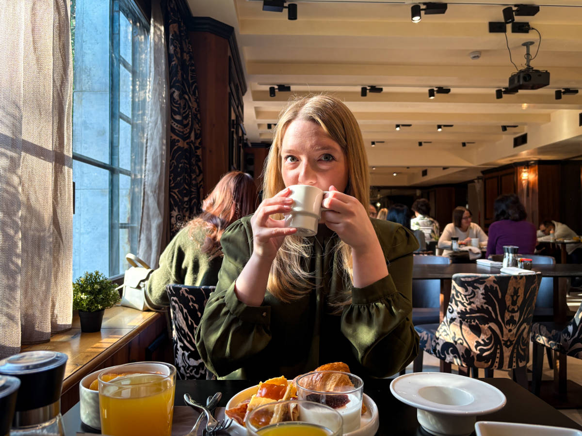 The author Taylor Herperger, enjoying her breakfast at Palazzo Veneziano