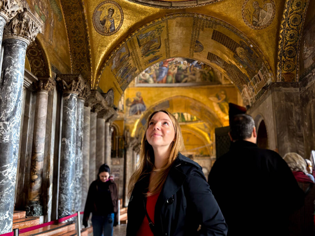 The author Taylor Herperger, admiring the intricate interior of St. Mark’s Basilica