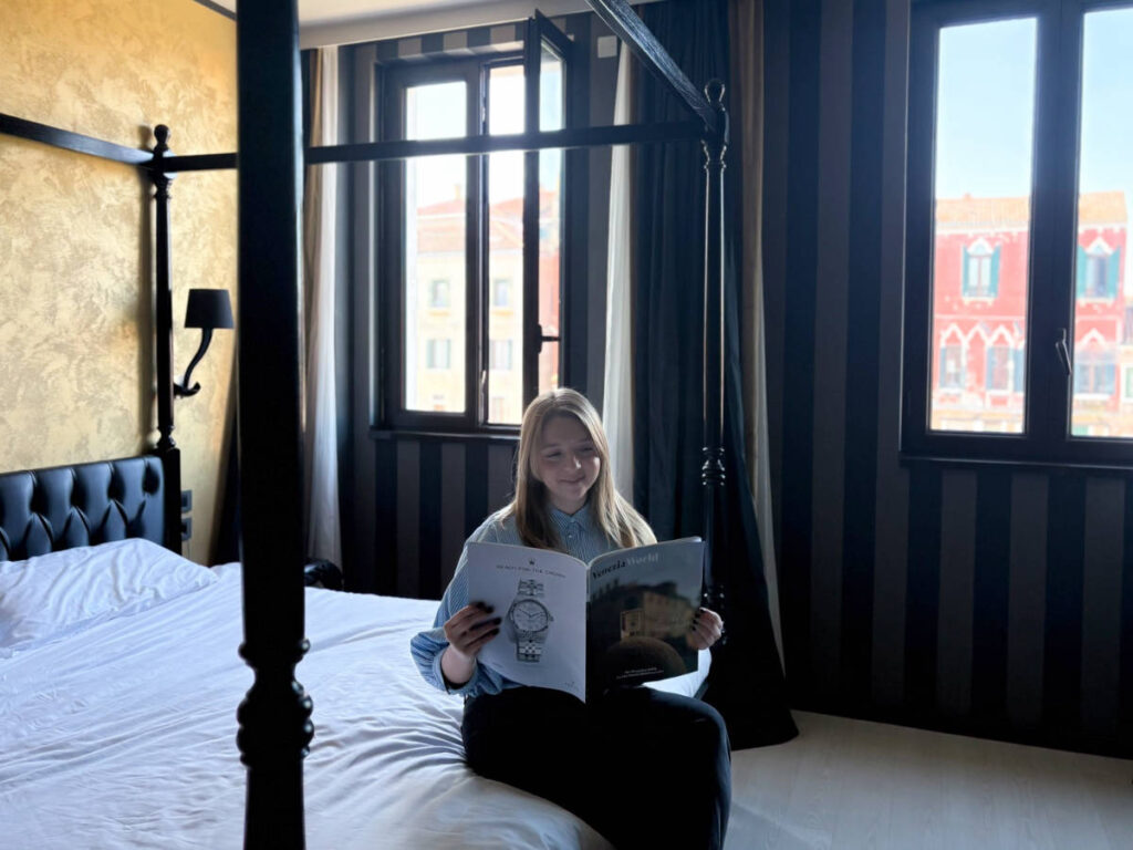 The author, Taylor Herperger reading a book at Carnival Palace
