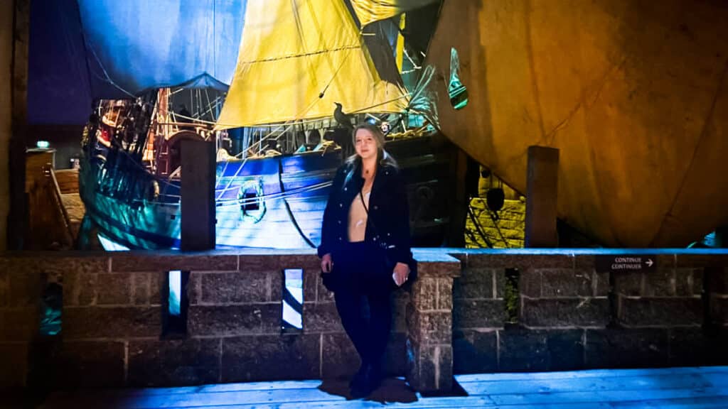 The author, Taylor Herperger posing at the Manitoba Museum with the ship  behind her