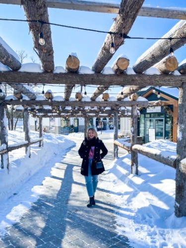 The author Taylor Herperger, posing at the snow covered pathway in Pineridge Hollow