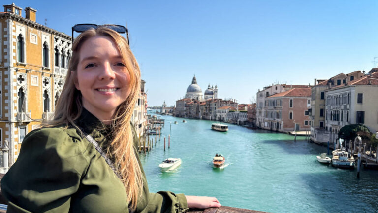 The author Taylor Herperger, enjoying the overlooking view of the canal at Ponte dell'Accademia