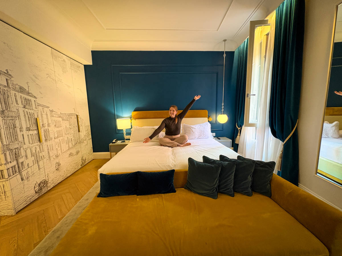 The author Taylor Herperger, showing her bright room at H10 Palazzo Canova